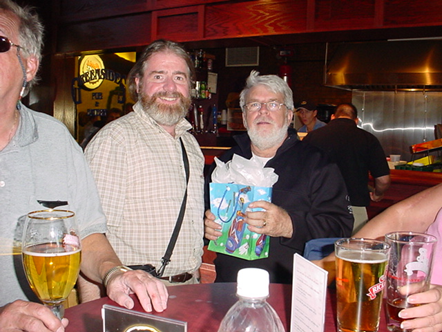 George Presents Gilles with Prize